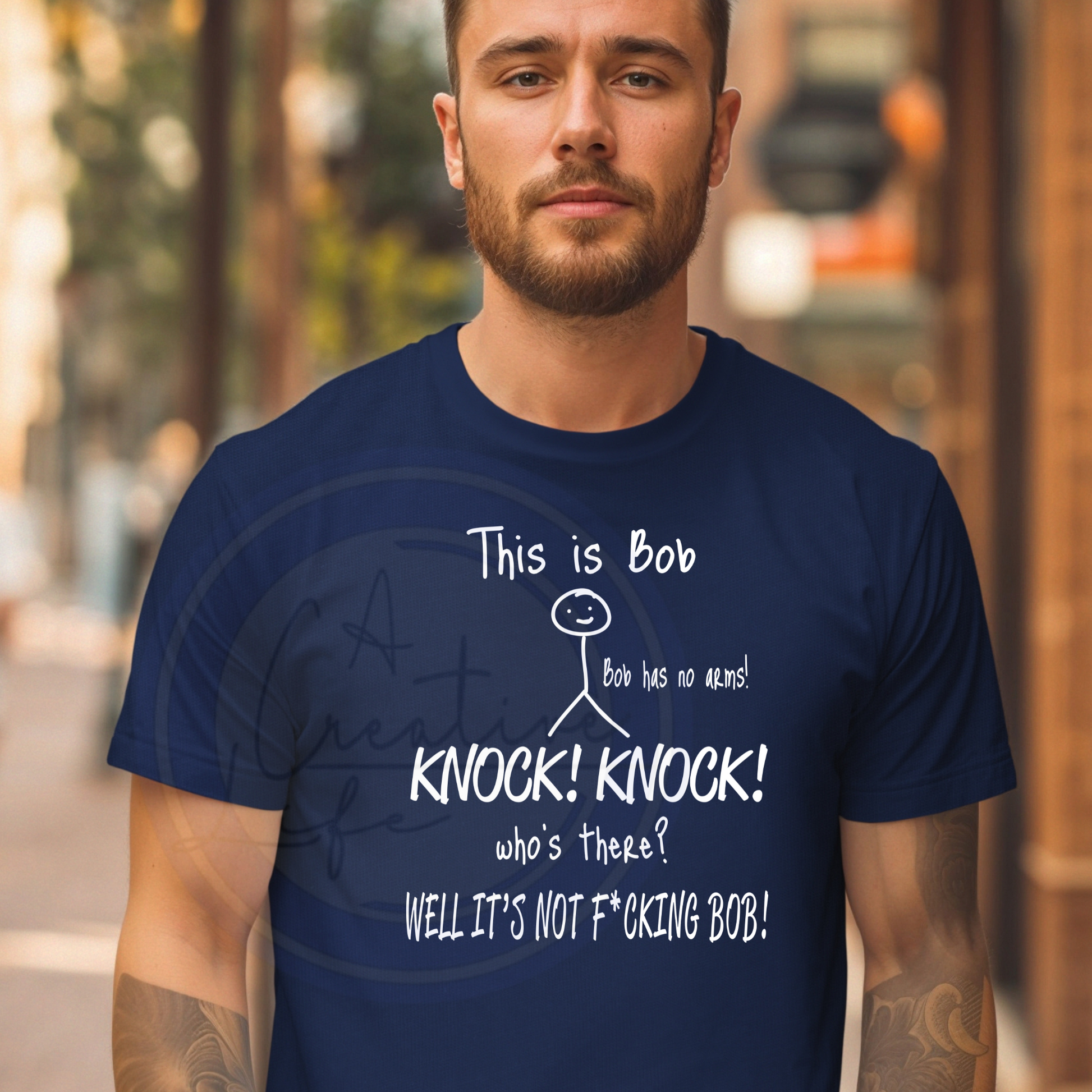 Man wearing a navy blue t-shirt with humorous text design.