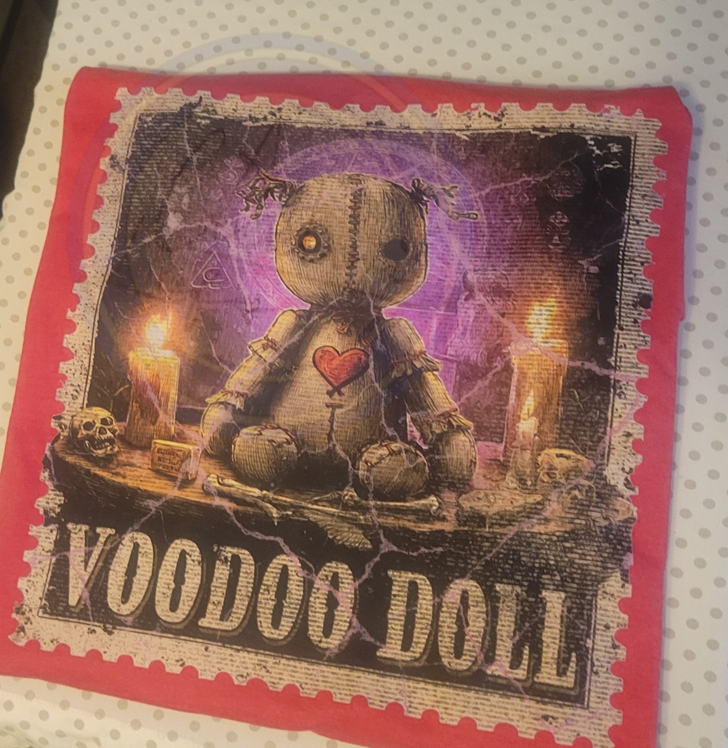 Voodoo doll with candles and skull on a red border with 'Voodoo Doll' text.
